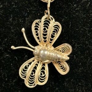 Antique silver butterfly pendant on 18” sterling silver chain.